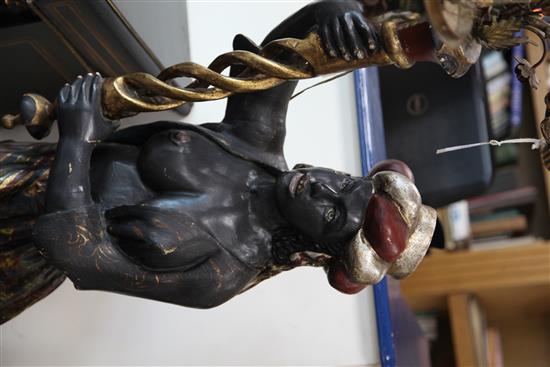 A pair of painted and giltwood blackamoor torcheres, H.6ft